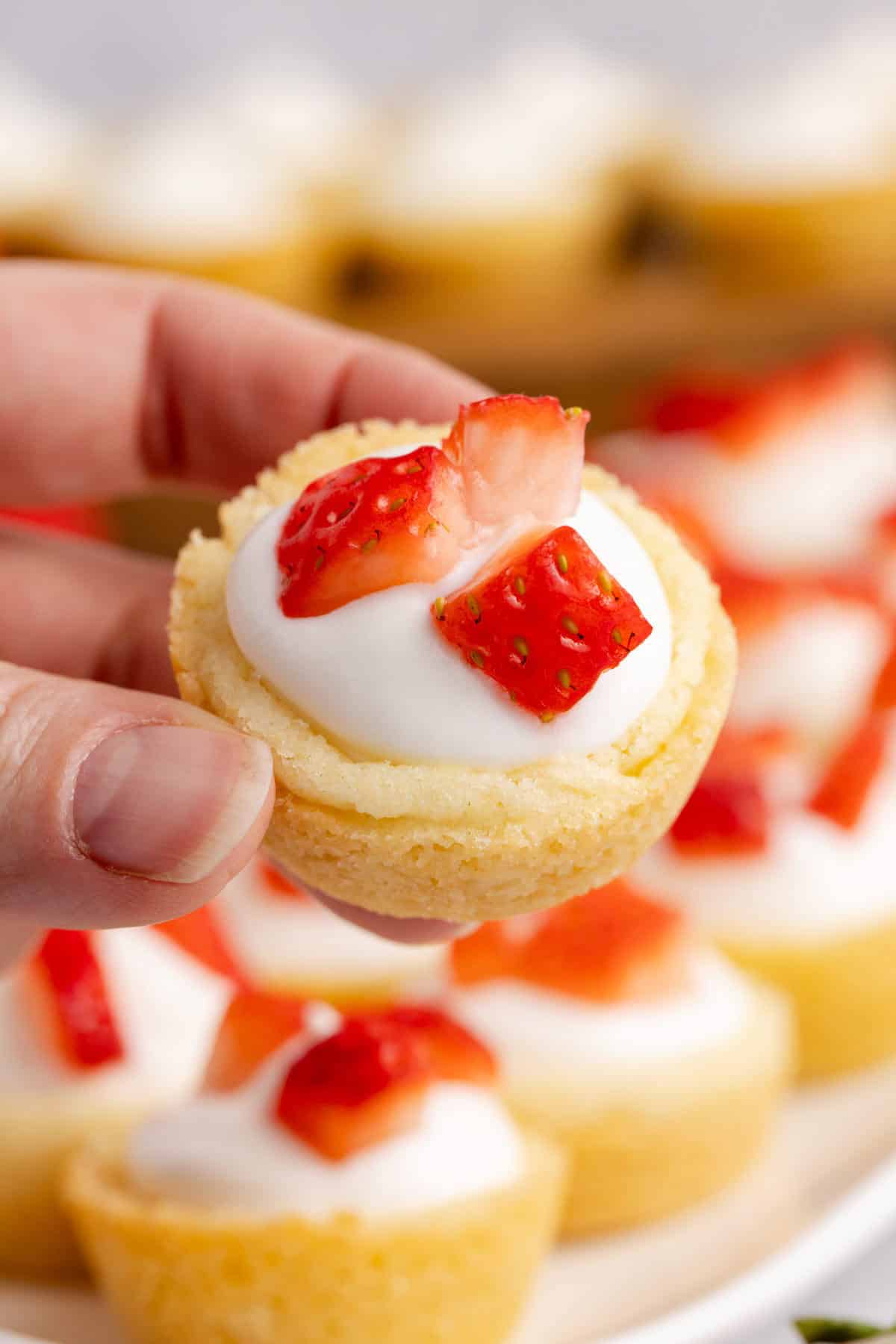 Strawberry Shortcake Cookie Cups being held up close
