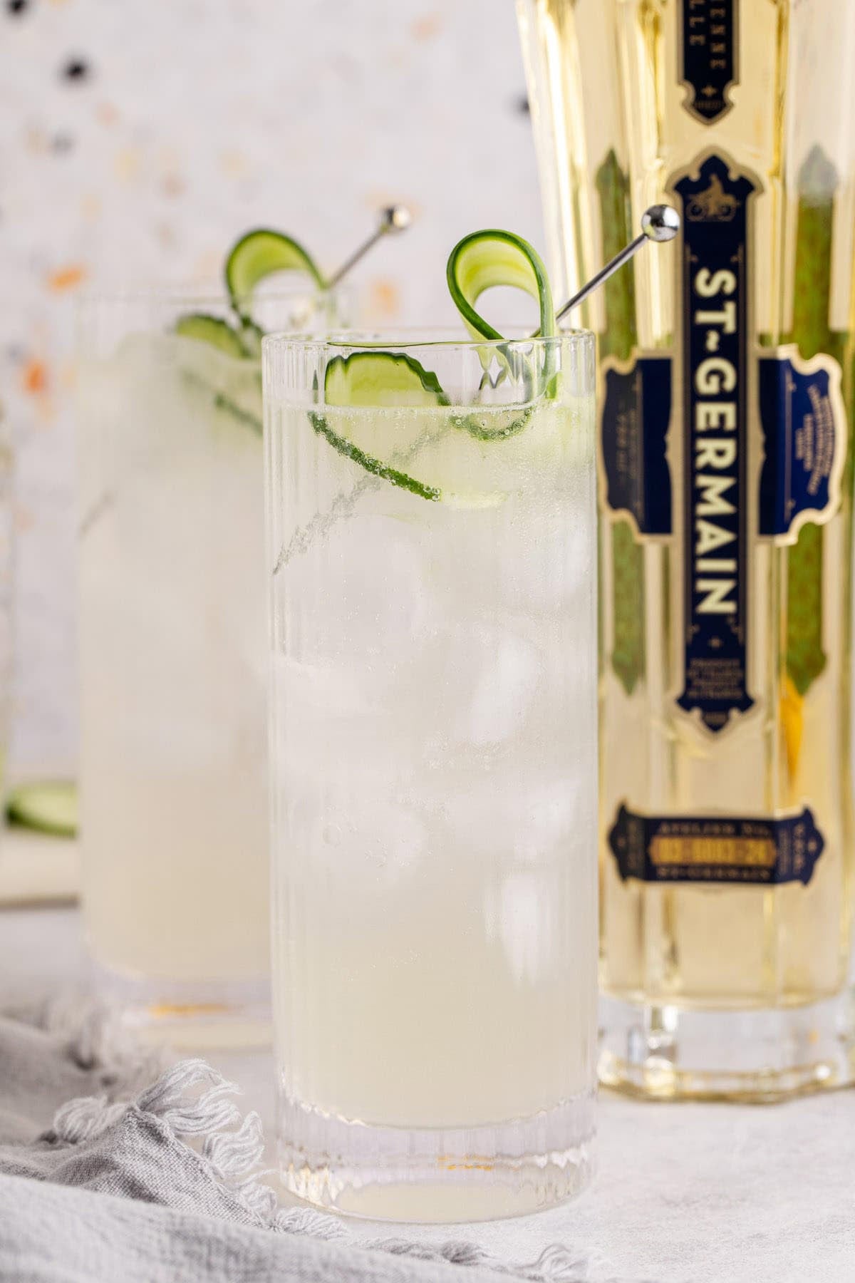 Cucumber Agua Fresca on a counter with a cucumber garnish