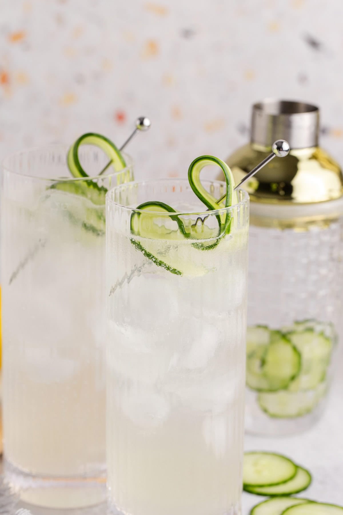 Cucumber Agua Frescas with a cocktail shaker in the back