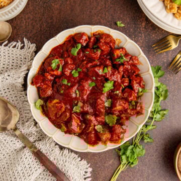 Asado de Puerco from above with rice and beans on a plate