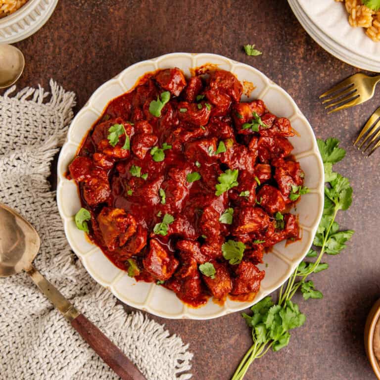 Asado de Puerco from above with rice and beans on a plate