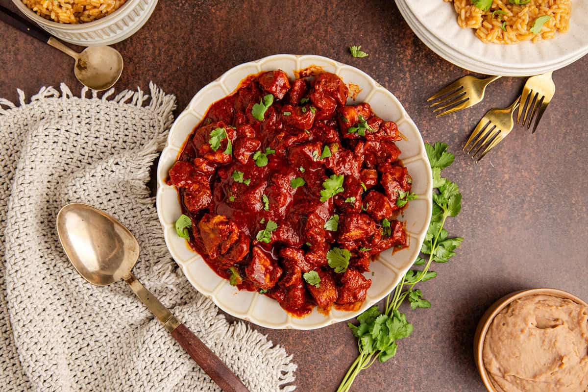 Asado de Puerco from above with rice and beans on a plate