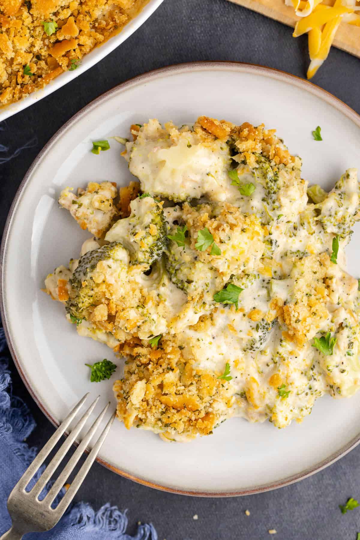 broccoli casserole with Ritz from above on a dish with a fork on the edge