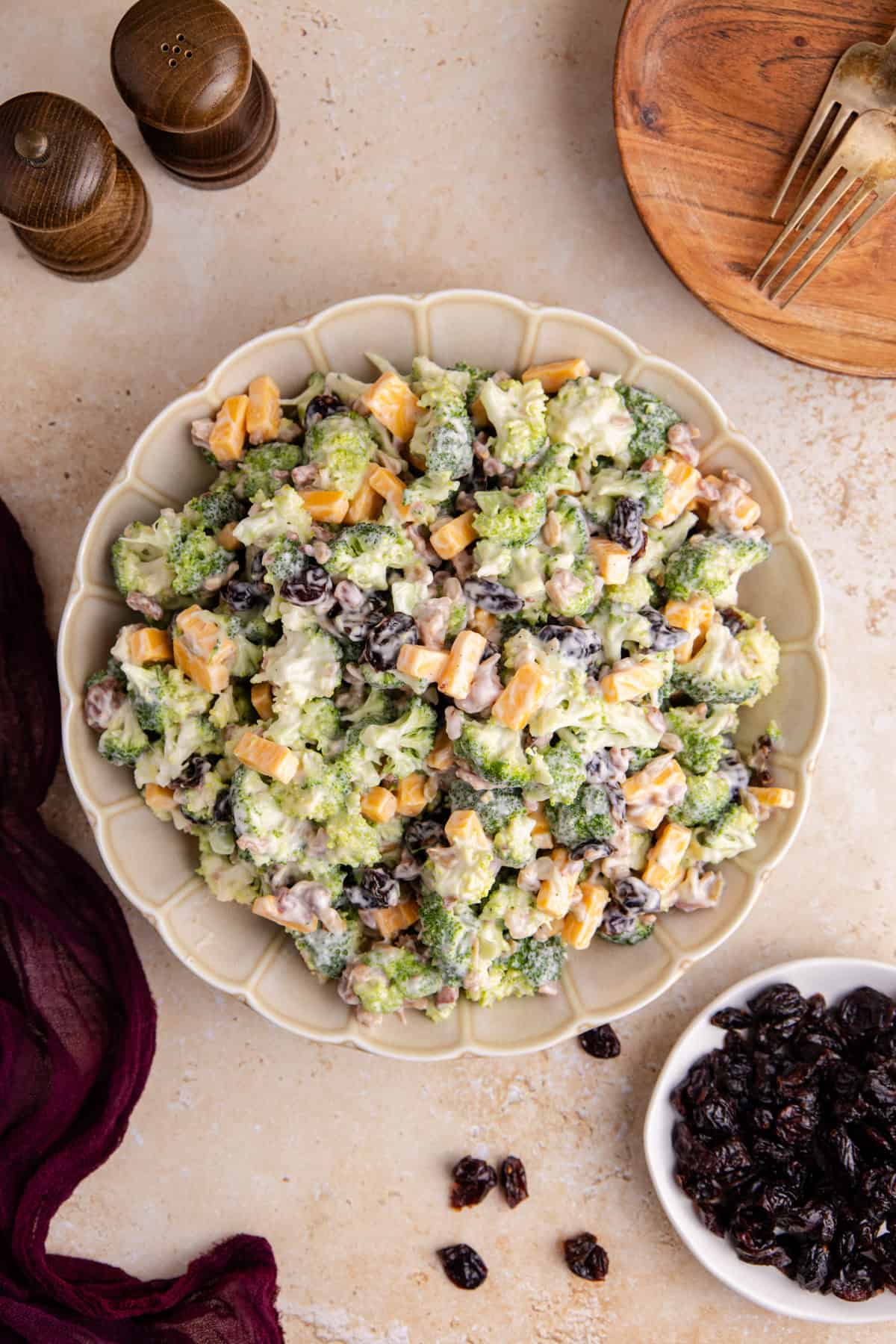 Broccoli Salad with Cranberries from above with a plates and forks beside