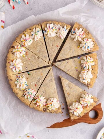 Chocolate chip cookie cake from above with slices all cut
