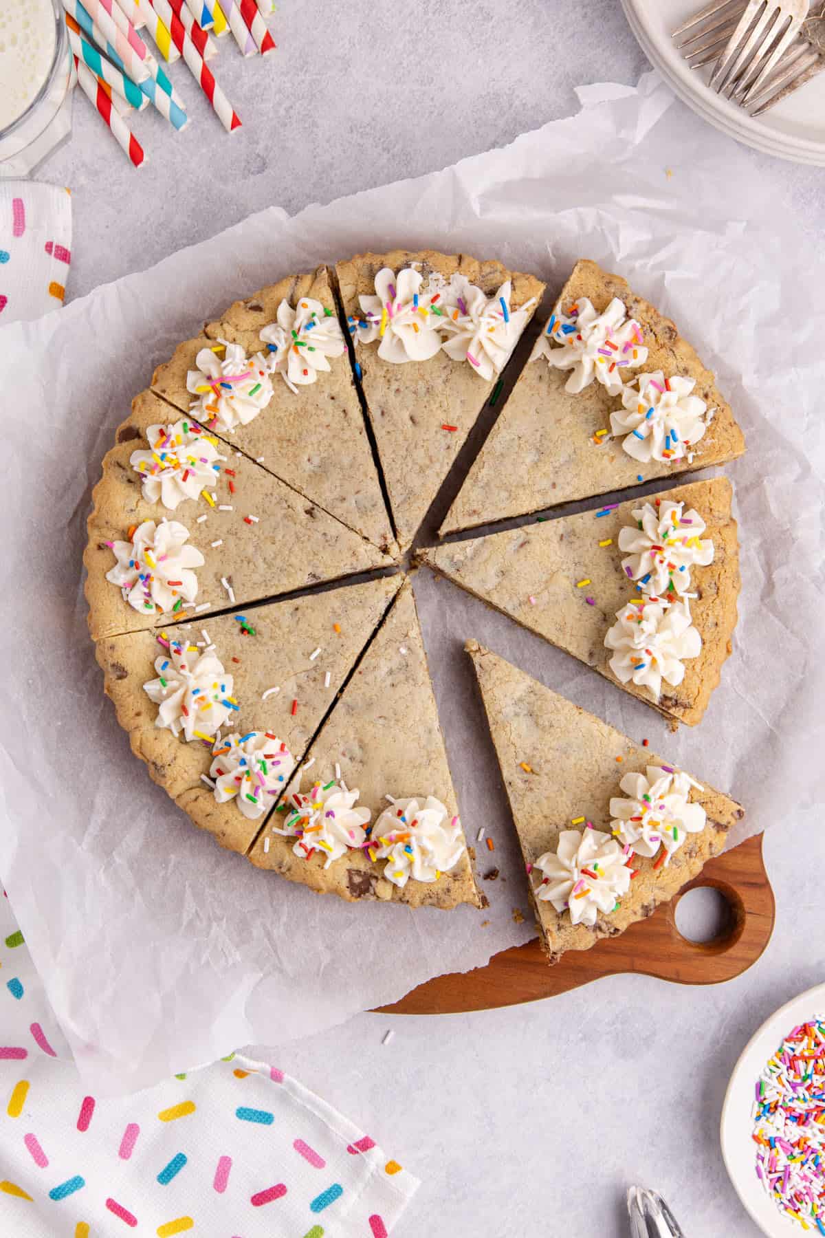Chocolate chip cookie cake from above with slices all cut
