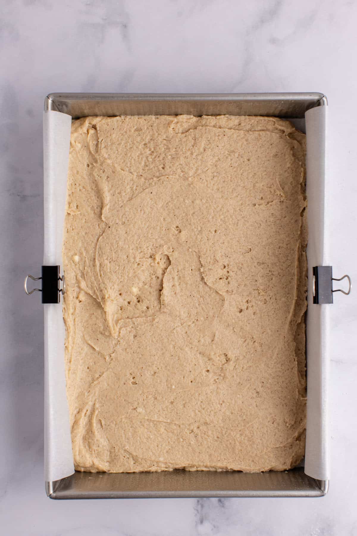 Cinnamon coffee cake batterin a 9x13 metal baking pan