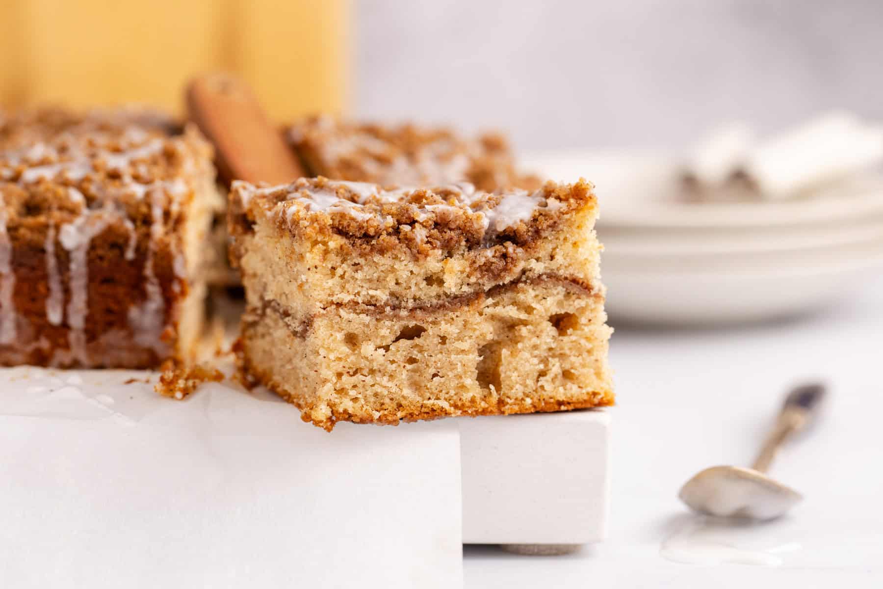 Cinnamon coffee cake slice on a marble cutting board