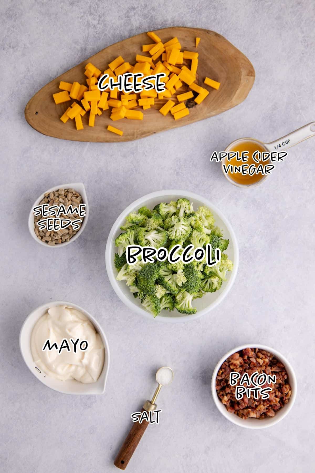 Keto broccoli salad ingredients on a counter