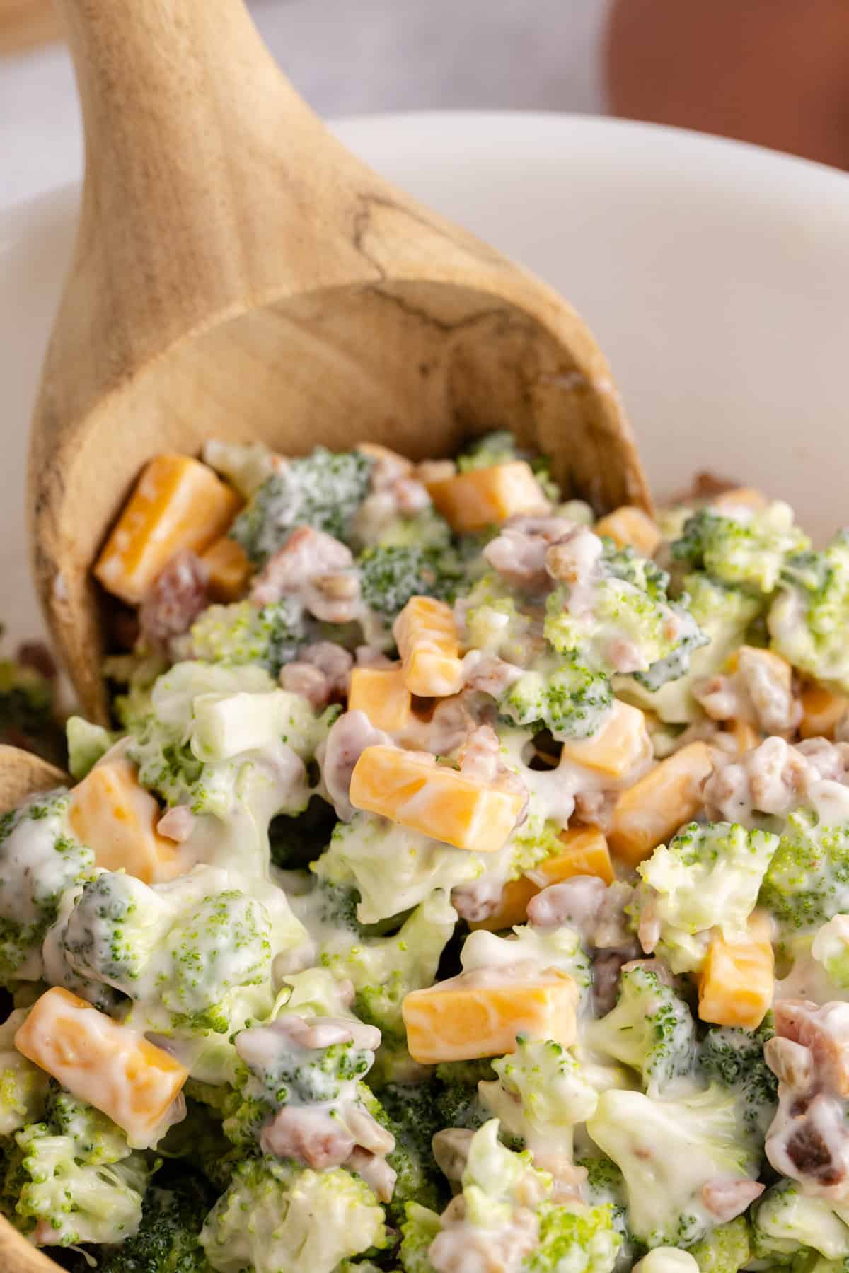 Keto broccoli salad close up with a serving spoon