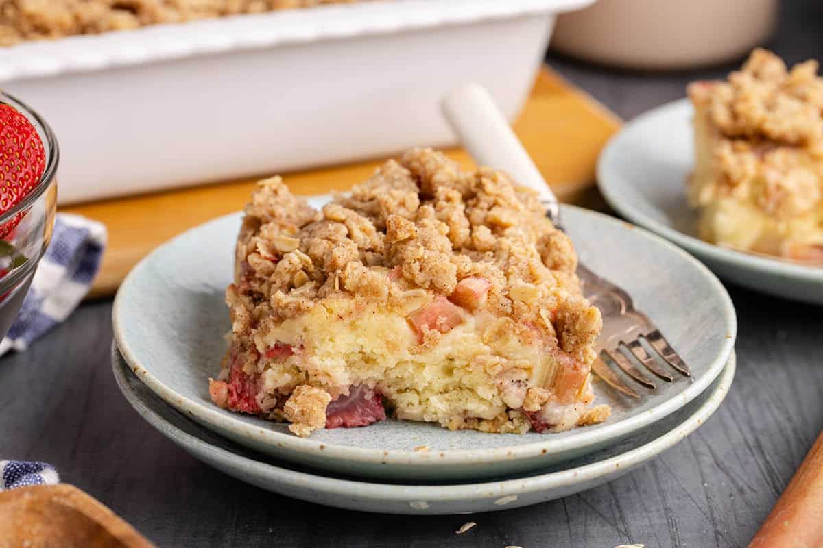 strawberry rhubarb coffee cake on a plate with a fork on it