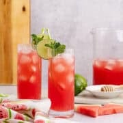 Watermelon Agua Frescas with watermelon slices beside