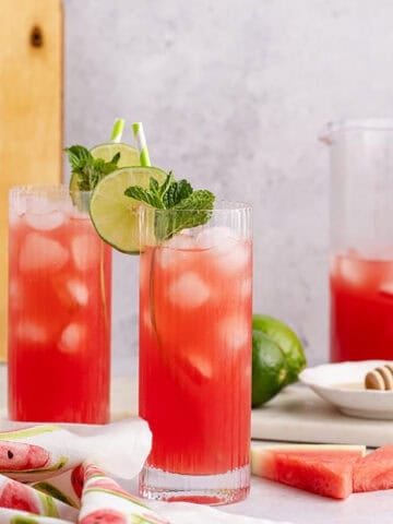 Watermelon Agua Frescas with watermelon slices beside