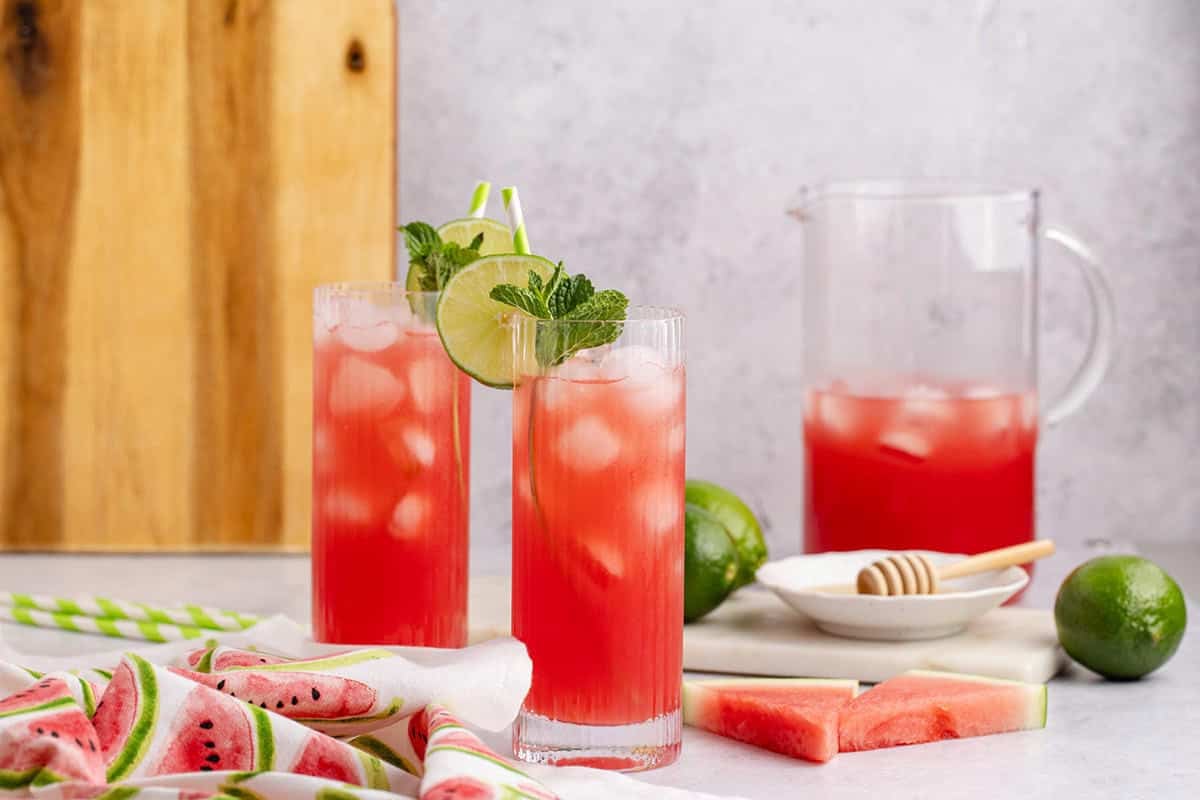 Watermelon Agua Frescas with watermelon slices beside