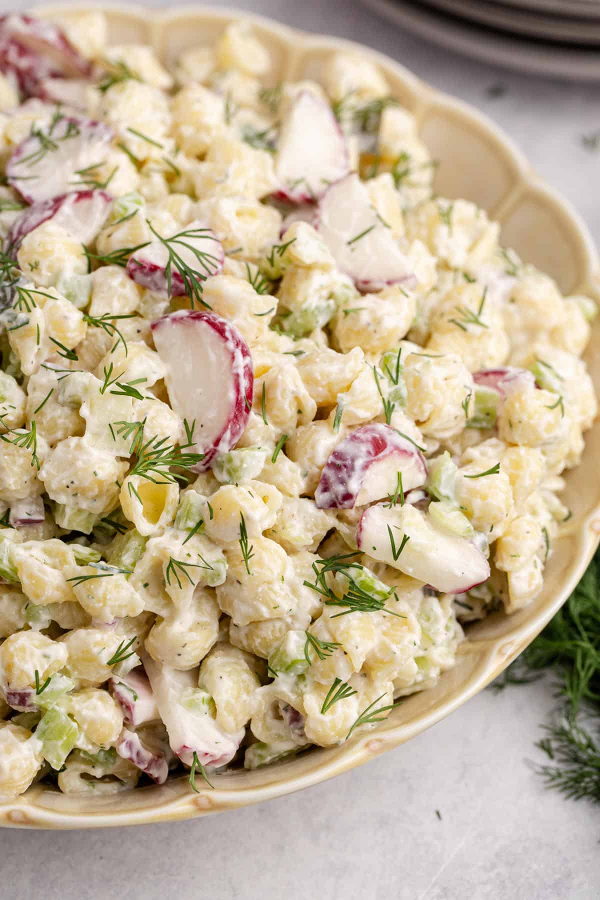 Pasta Salad with Fresh Dill in a serving bowl up close