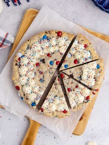 Red White and Blue Cookie Cake from above with half cut into slices
