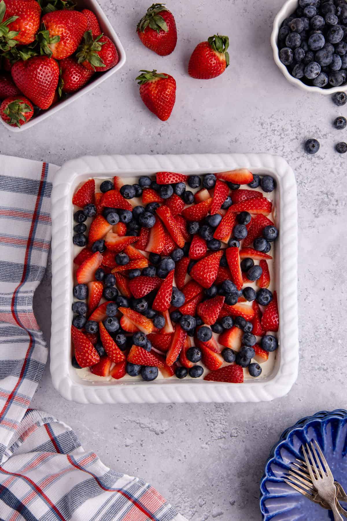 Red, White and Blue Pretzel Salad from above with berries around it