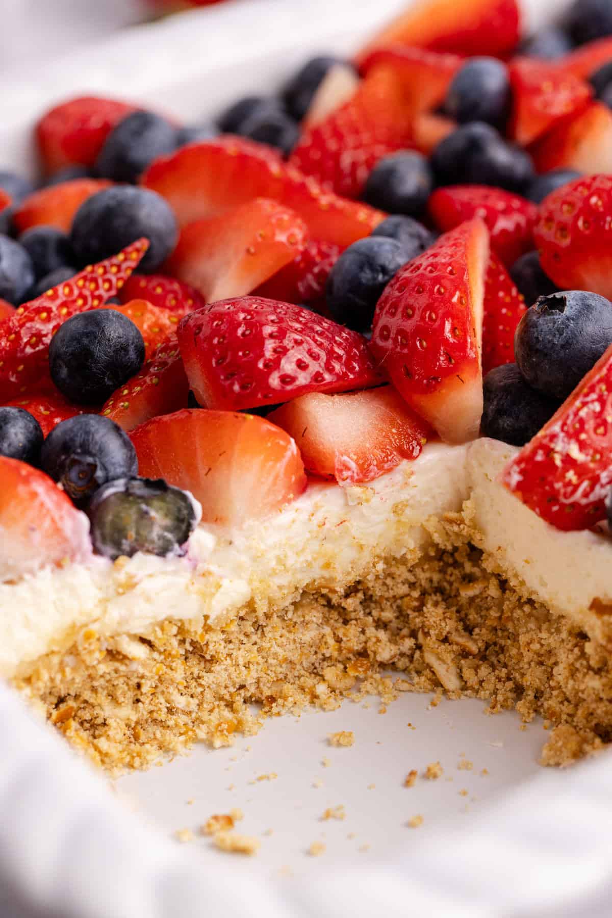 Red, White and Blue Pretzel Salad in a casserole dish up close to see the layers