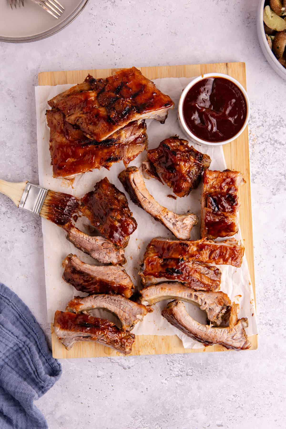 BBQ Ribs on parchment paper with sauce from above