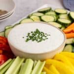 Cottage Cheese Ranch Dip in a serving bowl with vegetables all around