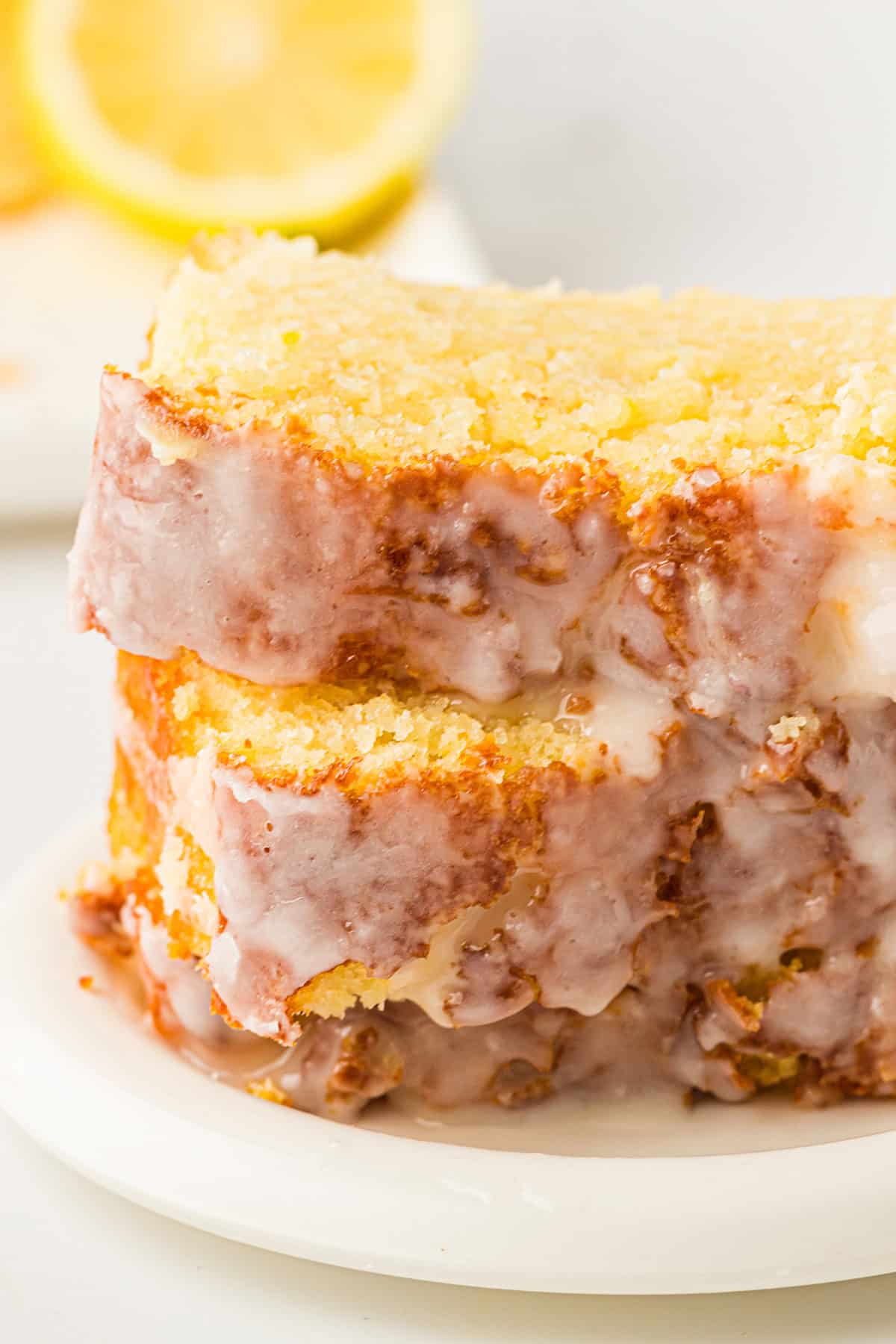 Old Fashioned Lemon Pound Cake slices stacked on a plate
