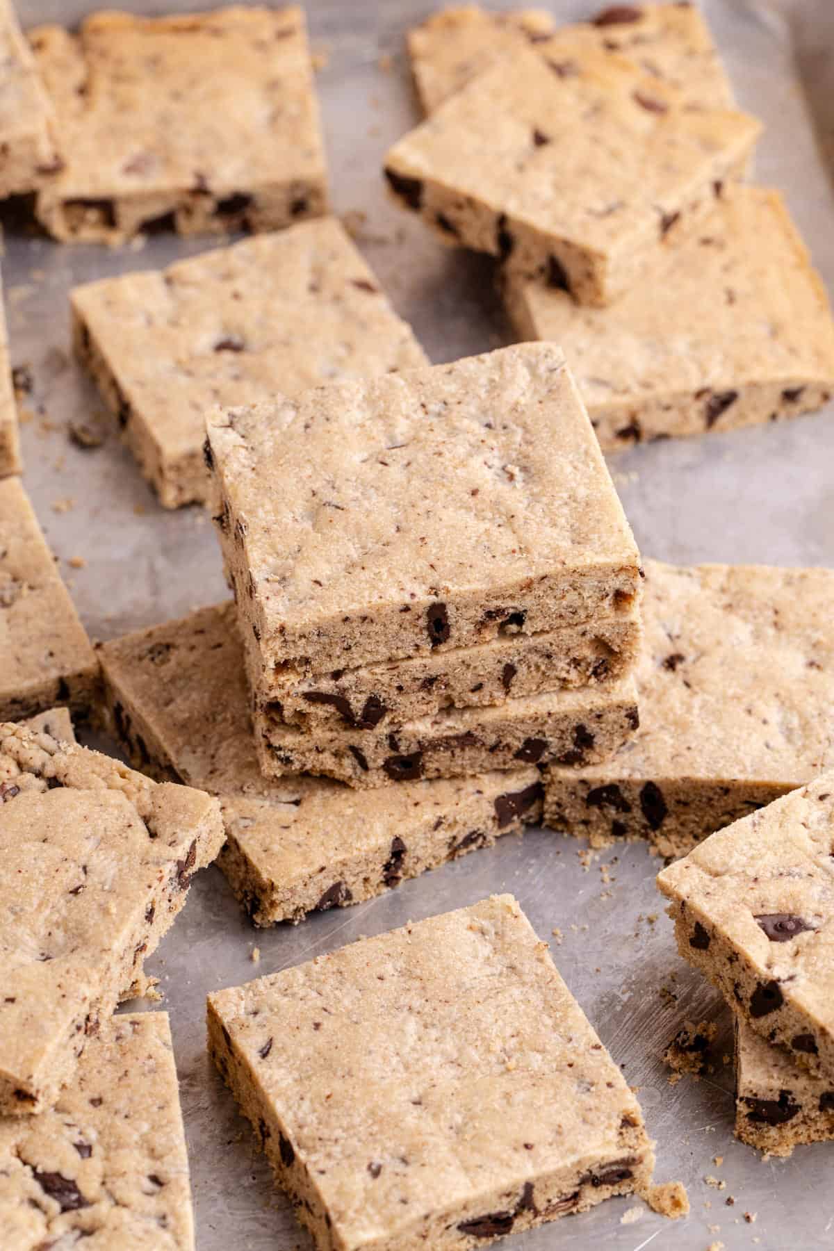 Sheet Pan Chocolate Chip Cookies on a pan stacked in piles