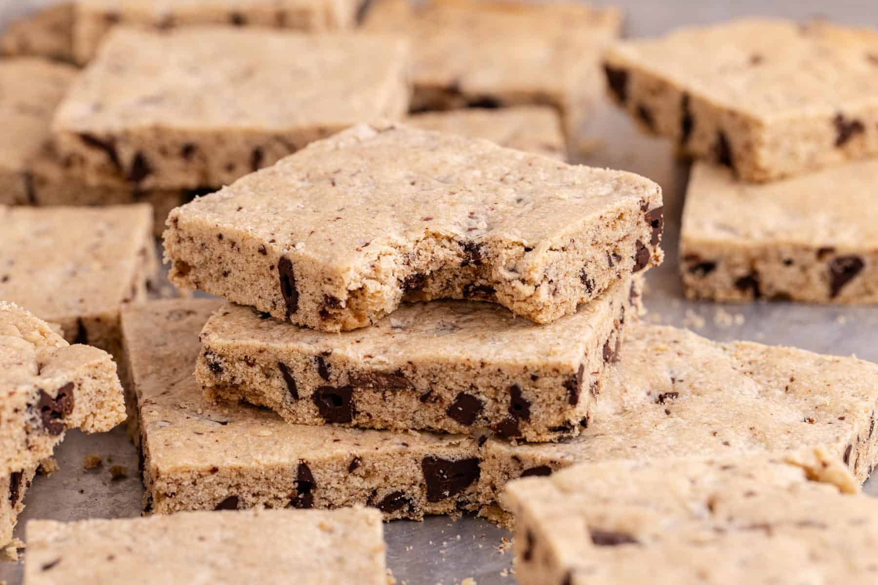 Sheet Pan Chocolate Chip Cookies on a pan with a bite taken