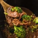Slow Cooker Beef and Broccoli close up on a serving spoon