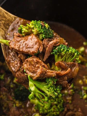 Slow Cooker Beef and Broccoli close up on a serving spoon