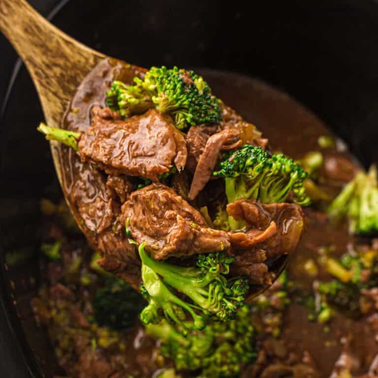 Slow Cooker Beef and Broccoli close up on a serving spoon