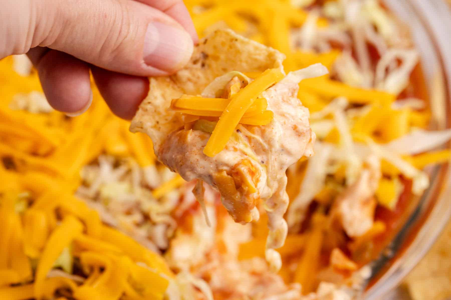 Taco Dip with Cream Cheese with a scoop being taken from overhead