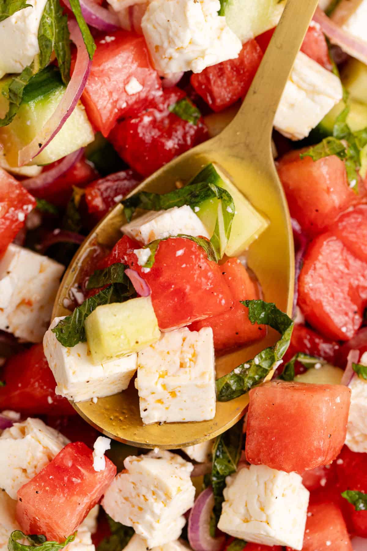 Watermelon Feta Salad close up on a serving spoon