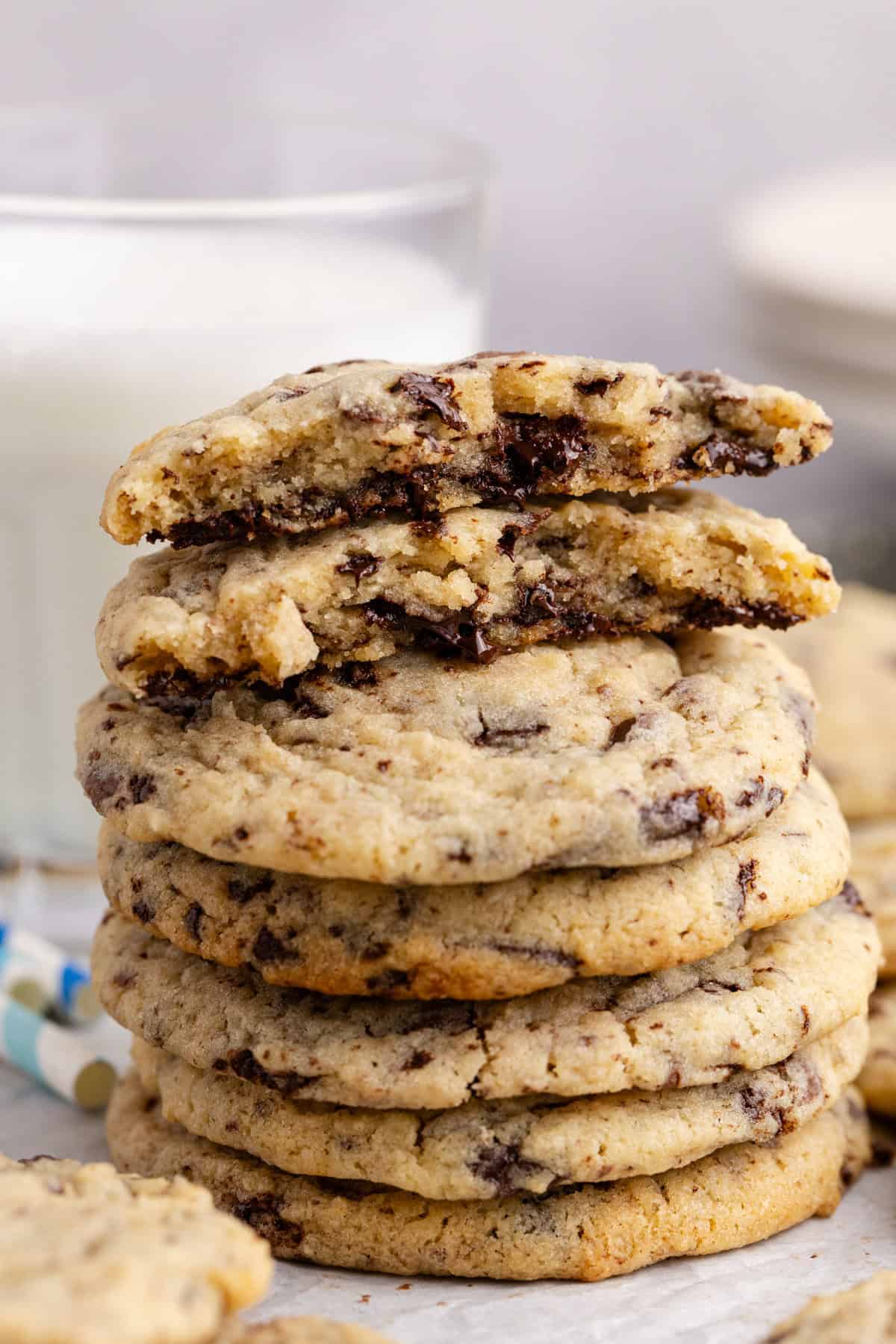 Chocolate Chip Vanilla Pudding Cookies broken in half on a stack of cookies