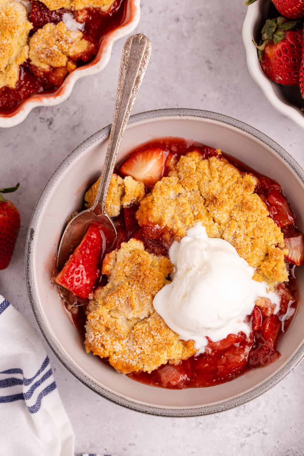 Gluten Free Strawberry Cobbler from above with a scoop of ice cream on top