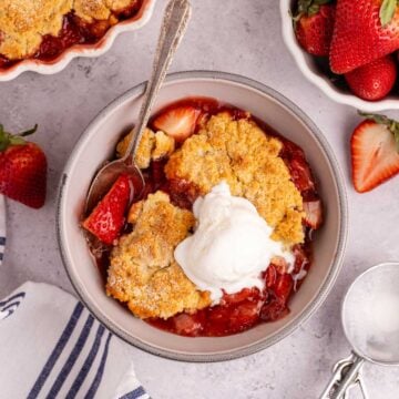 Gluten Free Strawberry Cobbler from above with a scoop of ice cream on top