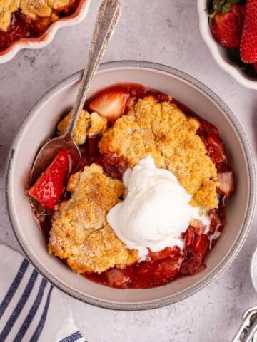 Gluten Free Strawberry Cobbler from above with a scoop of ice cream on top