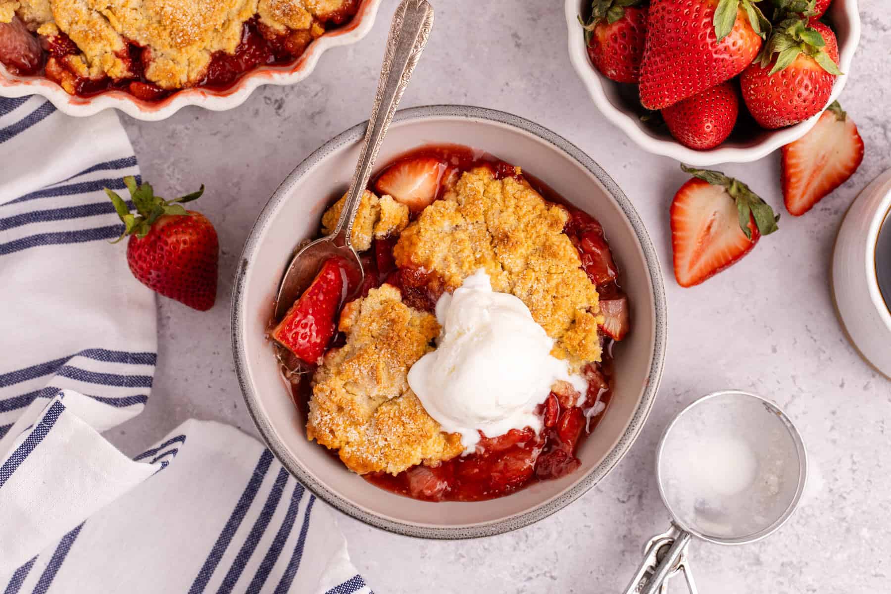 Gluten Free Strawberry Cobbler from above with a scoop of ice cream on top