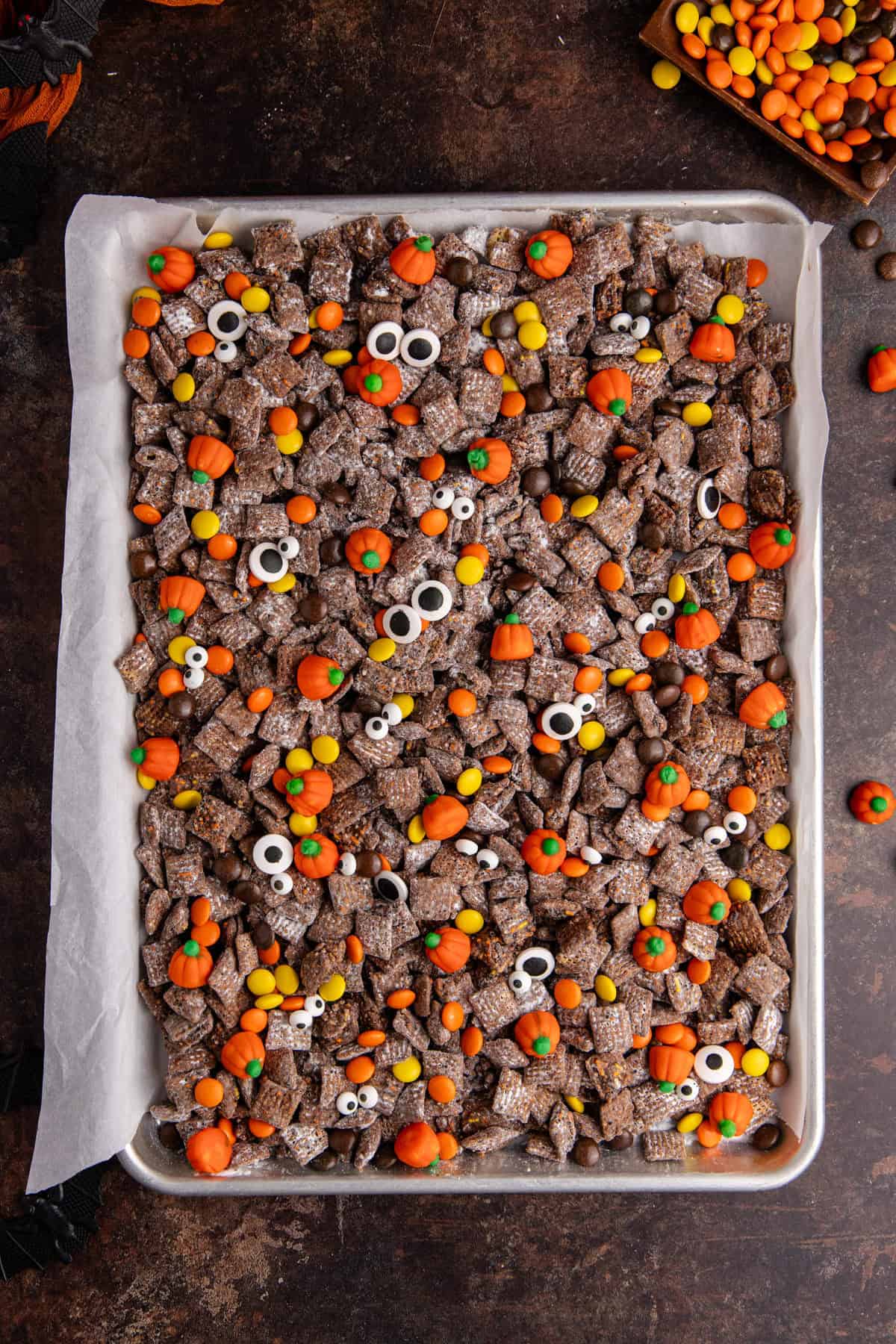 Halloween Puppy Chow on a baking sheet