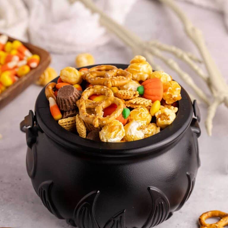 halloween snack mix served in black cauldron bowl