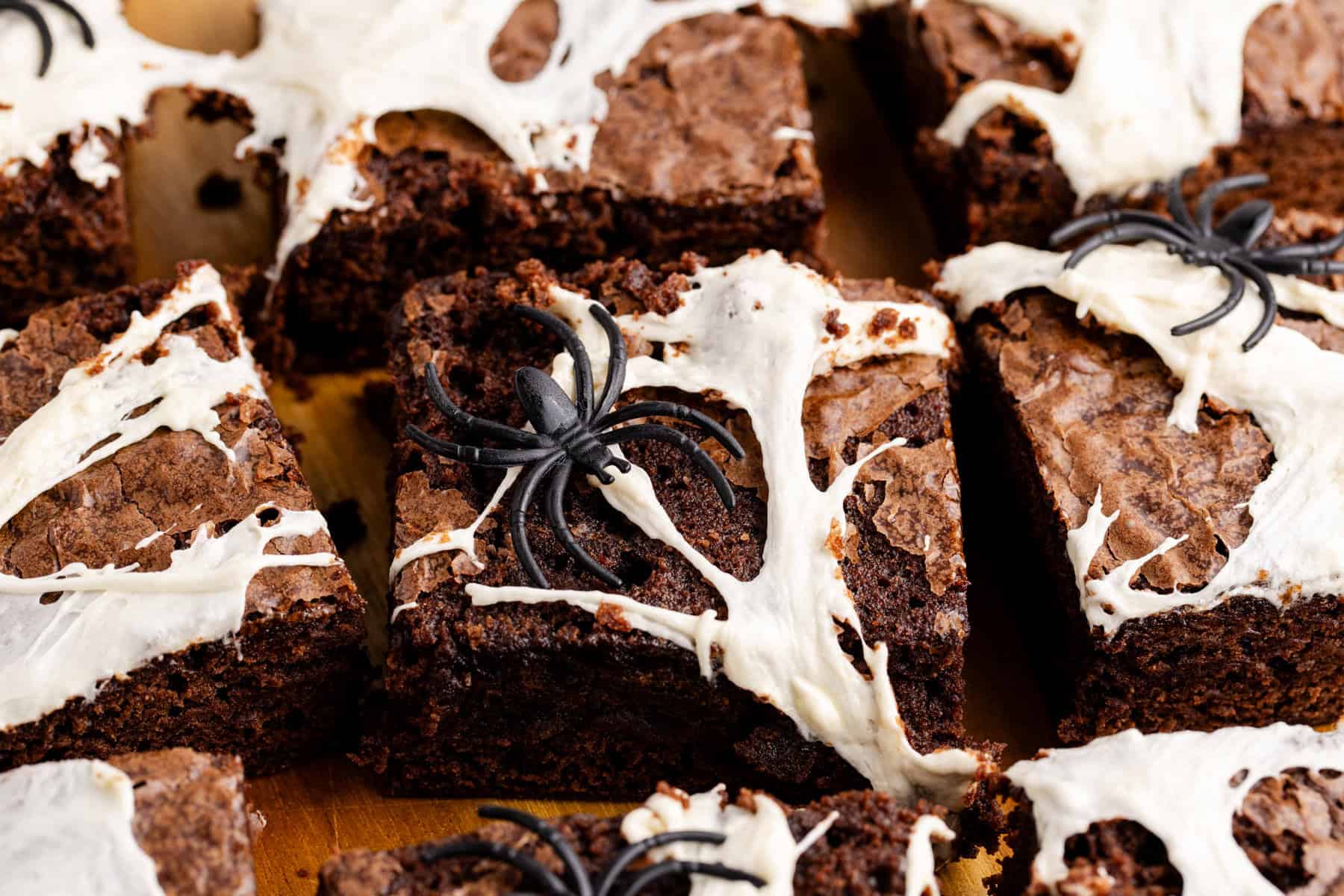 Spiderweb Brownies with plastic spiders on top