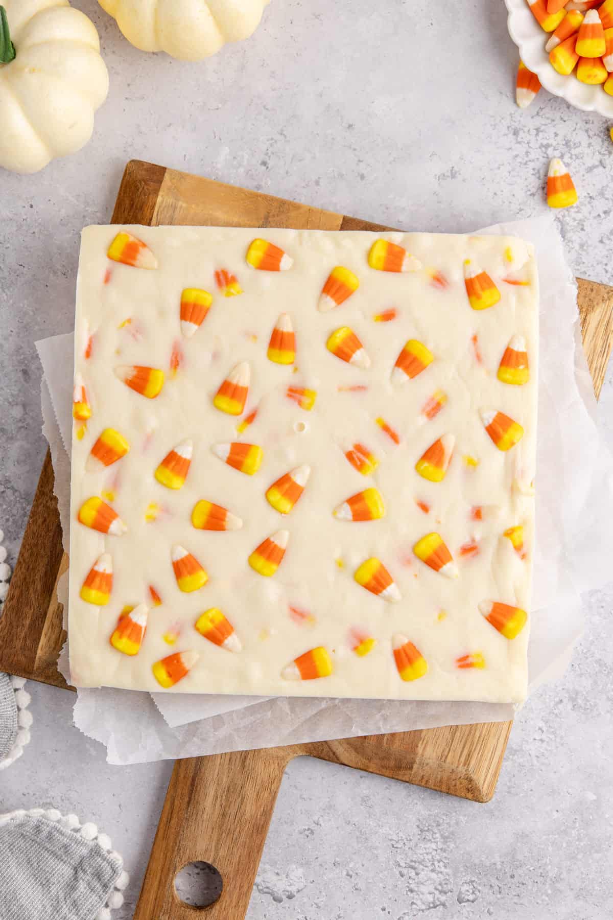 candy corn fudge on a wooden serving board
