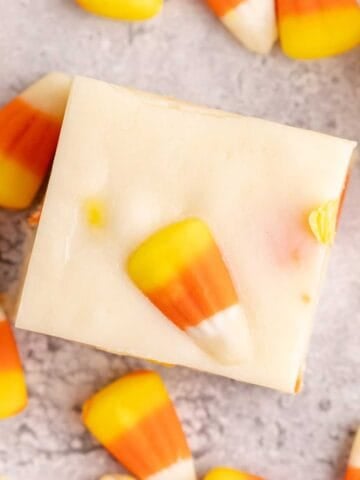 white chocolate candy corn fudge with candy corn beside