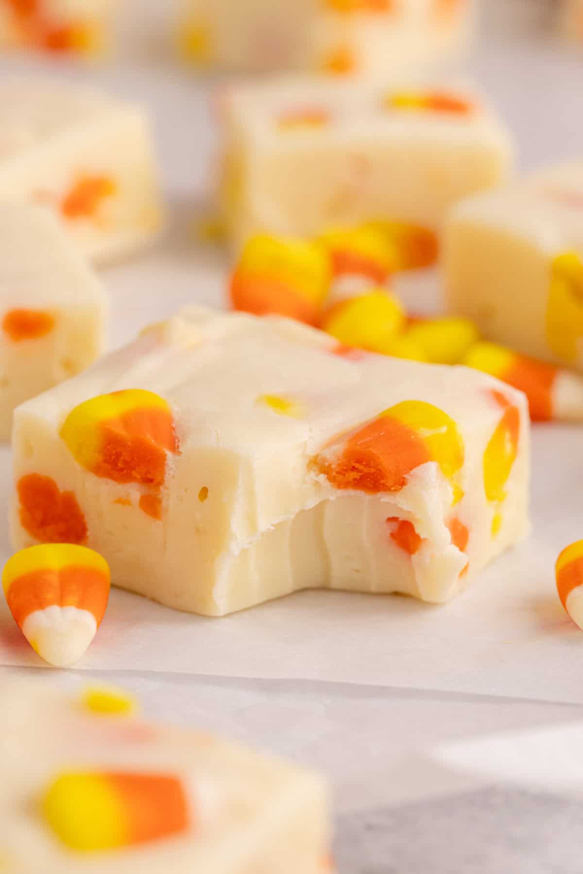 piece of candy corn fudge with bite taken