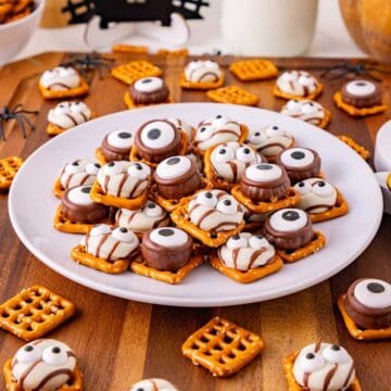 Monster Eye Pretzel Treats on a plate with more pretzels around