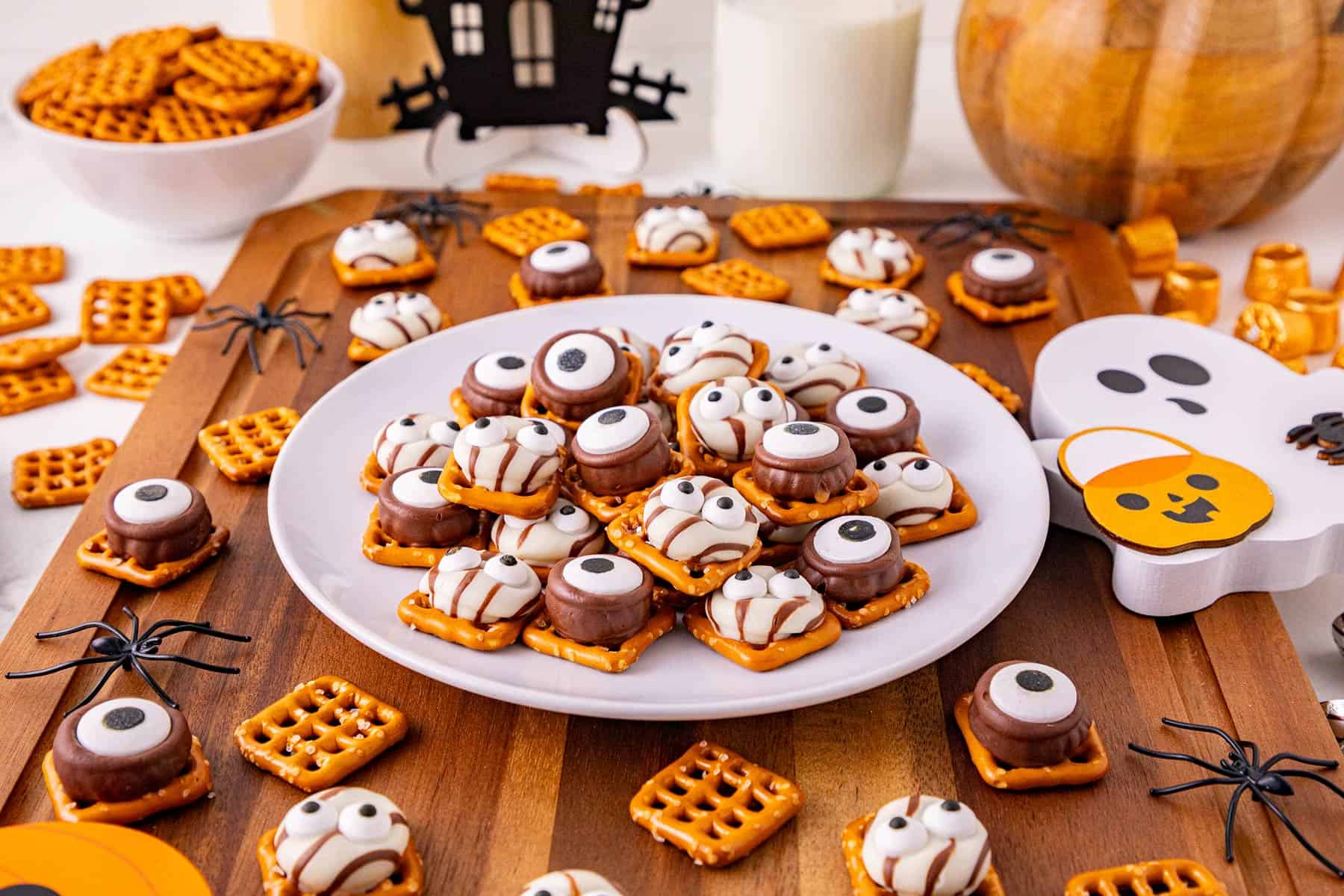 Monster Eye Pretzel Treats on a plate with more pretzels around