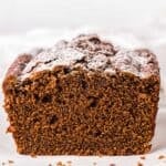 Spiced Gingerbread Loaf with a slice taken on a counter