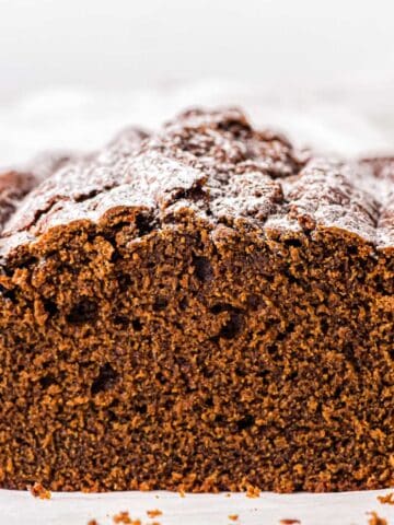 Spiced Gingerbread Loaf with a slice taken on a counter