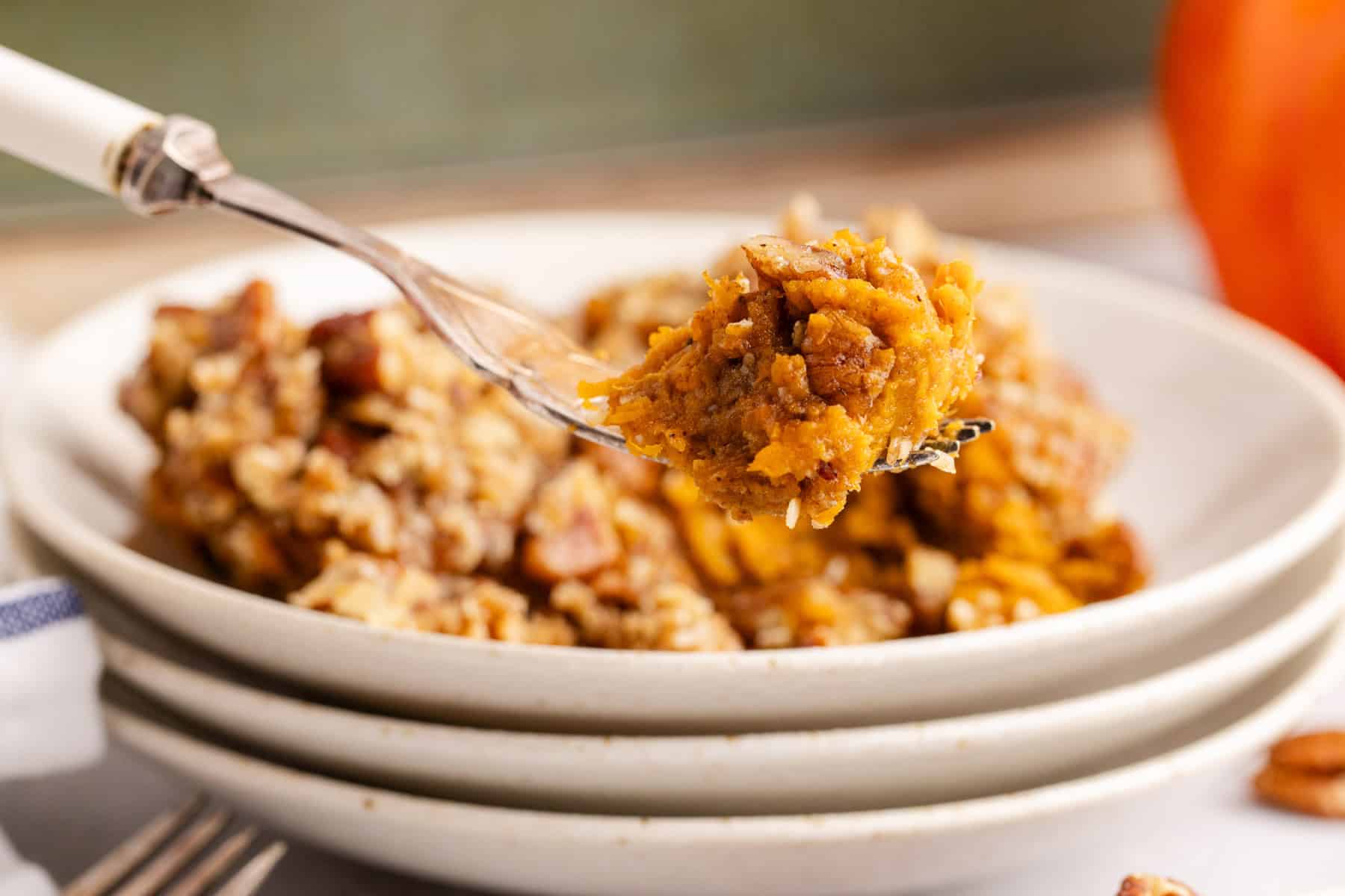 Sweet Potato Casserole with Pumpkin on a fork close up