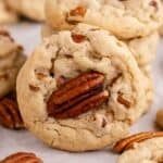 Butter Pecan Cake Mix Cookies stacked with one cookie leaning against it