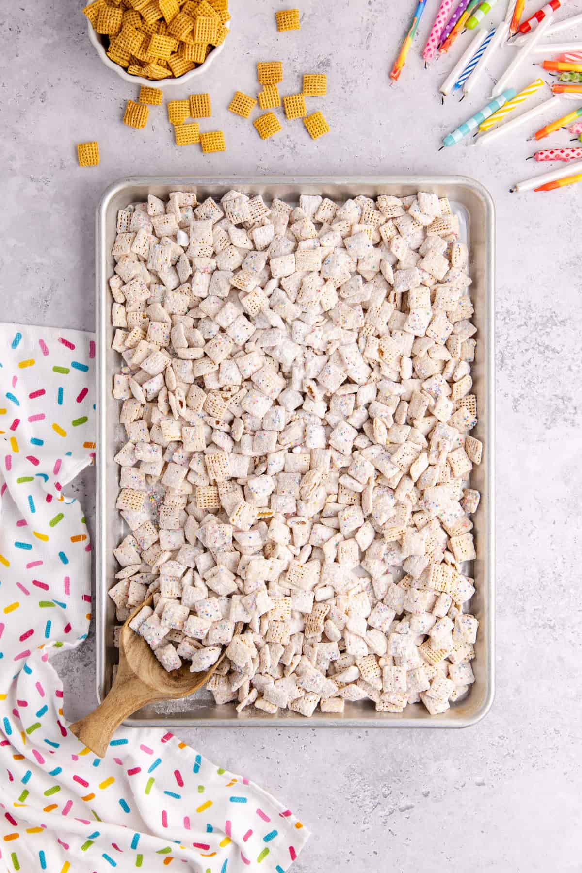 Cake Batter Puppy Chow on a cookie sheet from above